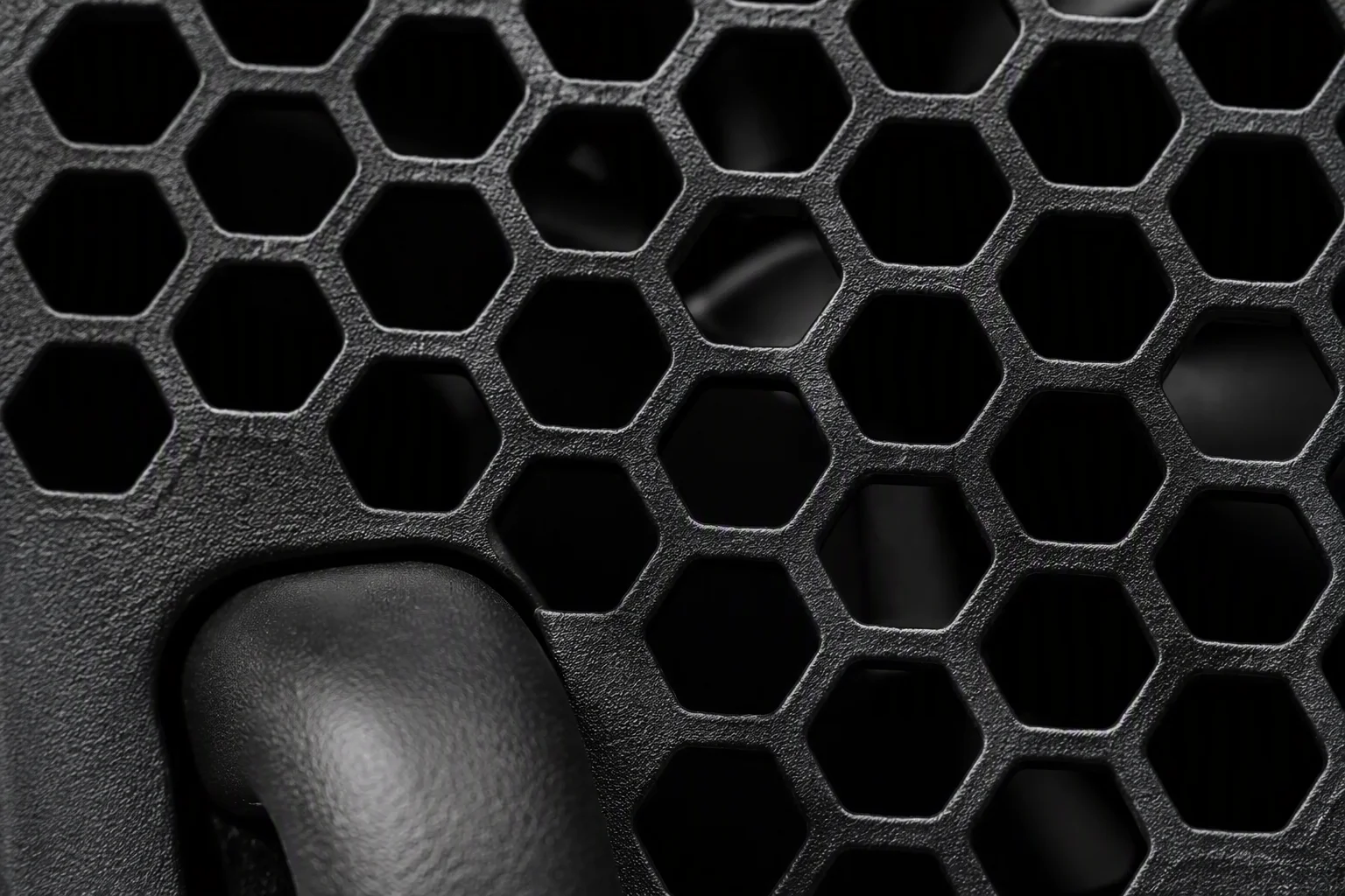 Macro of hexagonal vent pattern and handle on a CRPS chassis