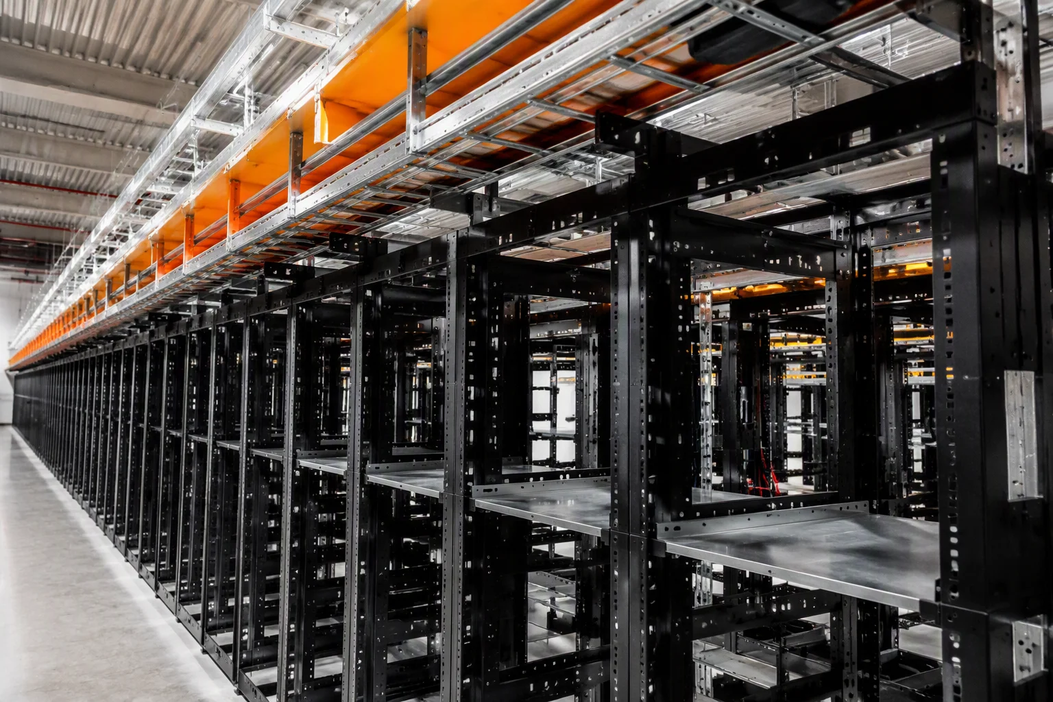 Rows of open-standard power shelves feeding hyperscale server racks over 54V busbars